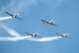 a quartet of Yaks, in diamond formation trailing smoke